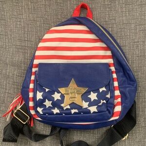 Red, white striped and blue starry Betsey Johnson mini backpack.
